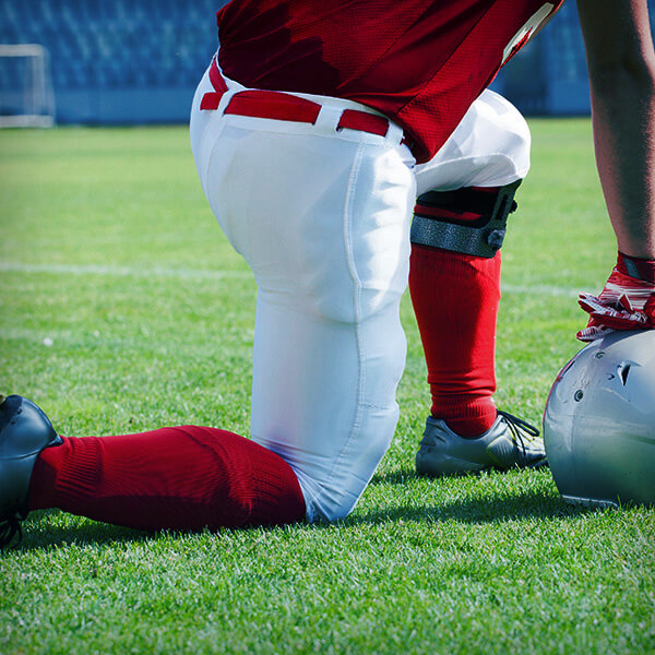 Image focused on Football player's knee