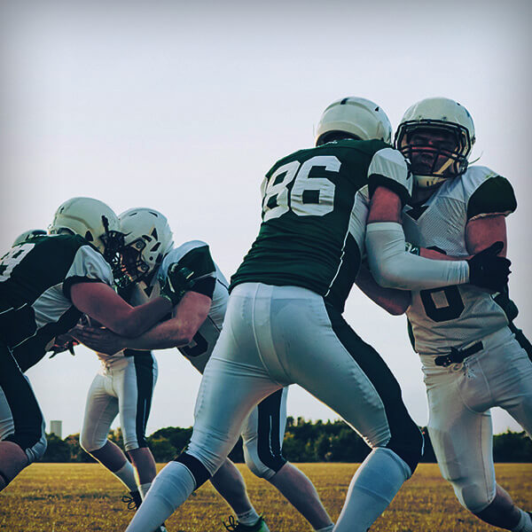 Image focused on Football players' shoulders