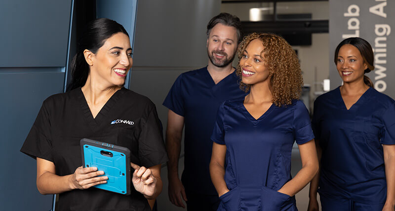 Four medical Professionals walking down a hallway